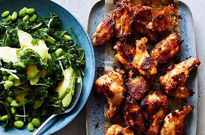 Marinated chicken wings with kale, avocado & edamame salad