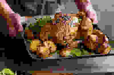 Miso coriander & ginger butter-stuffed roast chicken and potatoes