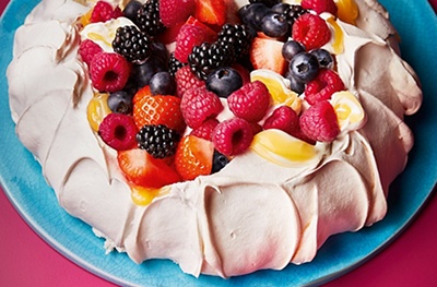 Mixed berry & lemon pavlova with strawberries, blackberries, blueberries and raspberries, lemon cream and Greek yogurt