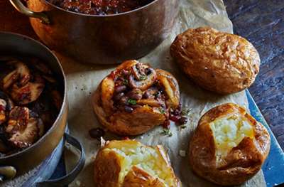 Mixed mushroom chilli with baked potatoes