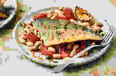 Pan-fried sea bream with cannellini beans and tomatoes