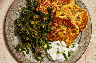 Parsnip, cauliflower & halloumi fritters with spiced spinach