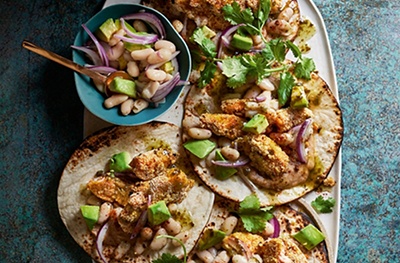 Polenta-crunch trout tacos, bean salsa & soured cream