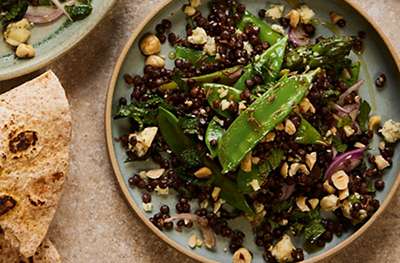 Puy lentils with asparagus, mangetout, hazelnuts & blue cheese