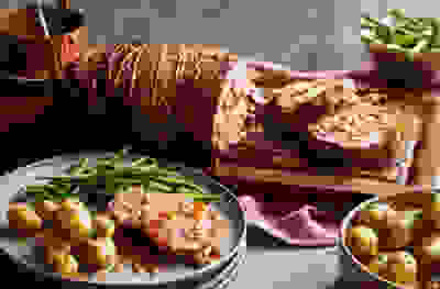 Roast lamb with pistachio, feta & lemon stuffing