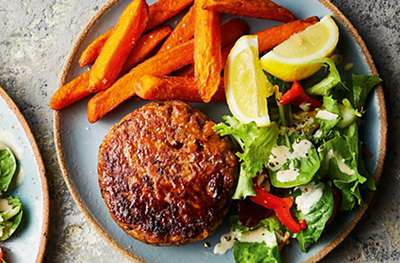 Spicy lamb & bean burgers with tahini-dressed salad and sweet potato chips