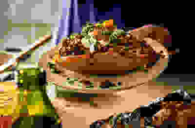 Spicy lentil jackets with cucumber yogurt & mango chutney