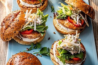 Spicy salmon burgers with sour cream slaw