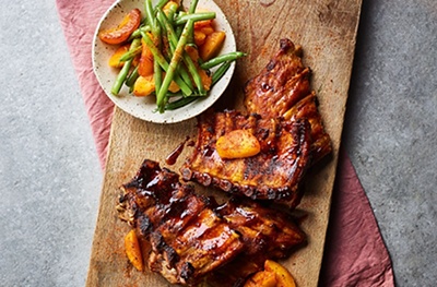 Sticky barbacoa ribs with grilled peach & bean salad