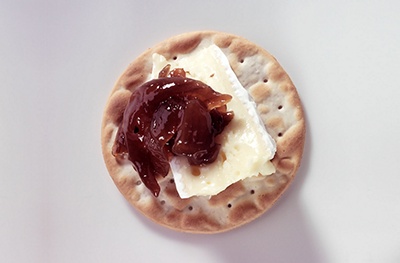 image of chutney and brie on a cracker