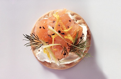 image of smoked salmon and cream cheese on a cracker