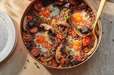 Tomato, mushroom & black pudding baked eggs