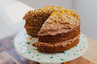 Vegan banana cake with chocolate frosting by Max La Manna