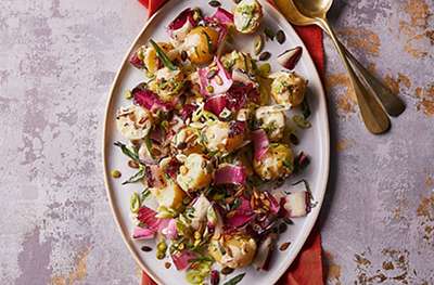 Warm potato salad with chicory, salad onions, caraway & super seeds
